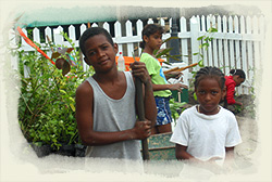 Placencia kids get to work making their Park lush and green